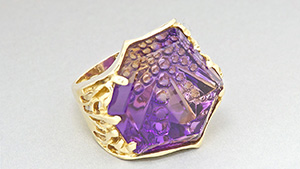 This 18K gold ring boasts a 52.62-ct. ametrine Dreamscape ™ cut by gem designer John Dyer. A gem of this size demands a bold design like this very handsome ring. Courtesy Cassanova's Jewelry