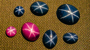Assortment of Linde synthetic star rubies and sapphires Assortment of Linde synthetic star rubies and sapphires