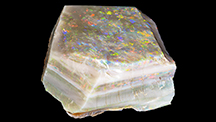 Color bars on top and sides of 3,019 ct rough opal Color bars on top and sides of 3,019 ct rough opal