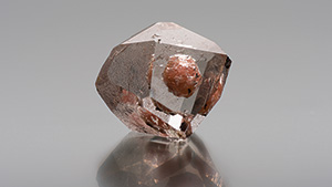 Pinkish orange inclusion in topaz. Pinkish orange inclusion in topaz.