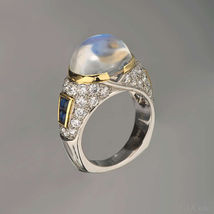 A platinum ring boasts the June birthstone, an 8.34 carat moonstone set with sapphires. A platinum ring boasts the June birthstone, an 8.34 carat moonstone set with sapphires.
