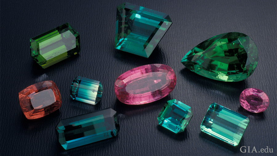 Blue, green, pink, and orange tourmaline in different cuts display the multi-colors found in the October birthstone. Blue, green, pink, and orange tourmaline in different cuts display the multi-colors found in the October birthstone.