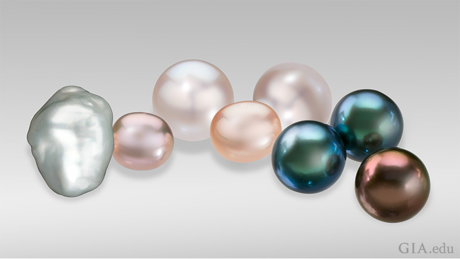 A baroque cultured pearl, small fancy pink and peach off-round freshwater cultured pearls, round white Australian cultured pearls, and black and brown Tahitian cultured pearls display the variety of the June birthstone. A baroque cultured pearl, small fancy pink and peach off-round freshwater cultured pearls, round white Australian cultured pearls, and black and brown Tahitian cultured pearls display the variety of the June birthstone.
