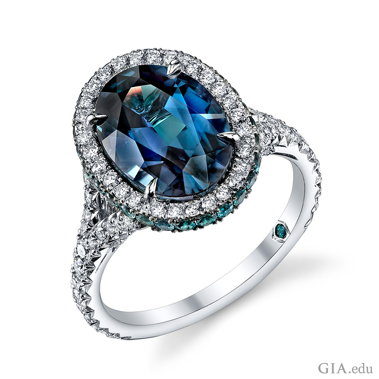 The June birthstone is prominent in a 5.16 carat oval alexandrite ring surrounded by brilliant round diamonds and alexandrites set in platinum. The June birthstone is prominent in a 5.16 carat oval alexandrite ring surrounded by brilliant round diamonds and alexandrites set in platinum.