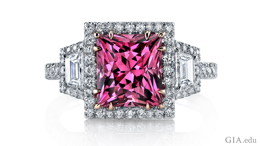 The August birthstone is featured in a 3.55 carat princess cut pink spinel ring surrounded by round brilliant diamonds and two trapezoid diamonds. The August birthstone is featured in a 3.55 carat princess cut pink spinel ring surrounded by round brilliant diamonds and two trapezoid diamonds.
