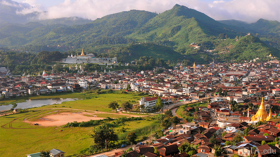 Landscape of a Mogok town where the July birthstone ruby is mined, with a green mountainside and lake created from gem mining in British colonial times. Landscape of a Mogok town where the July birthstone ruby is mined, with a green mountainside and lake created from gem mining in British colonial times.