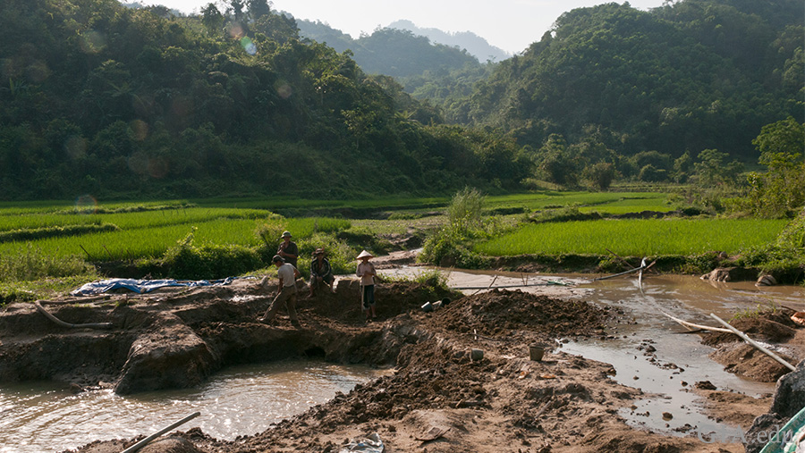The August birthstone is found in the landscape of Vietnam’s Luc Yen region. A ruby and spinel mining operation is in the foreground, with rice paddies rolling behind it against mountains cloaked in trees. The August birthstone is found in the landscape of Vietnam’s Luc Yen region. A ruby and spinel mining operation is in the foreground, with rice paddies rolling behind it against mountains cloaked in trees.
