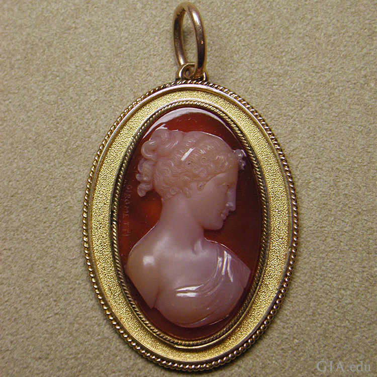 The August birthstone is displayed in an early 19th century Italian sardonyx cameo mounted in gold as a pendant. The August birthstone is displayed in an early 19th century Italian sardonyx cameo mounted in gold as a pendant.