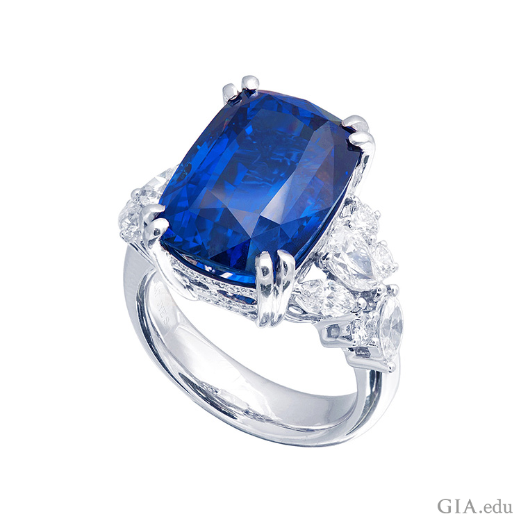 A rich blue sapphire set in a ring with diamonds shows off the September birthstone. A rich blue sapphire set in a ring with diamonds shows off the September birthstone.
