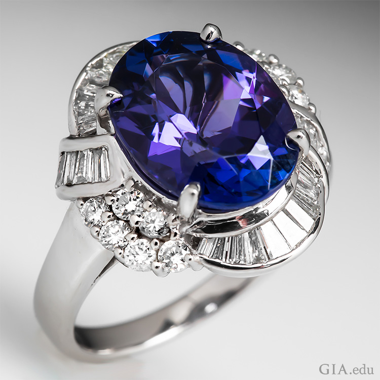 This tanzanite ring boasts the December birthstone with a 5.59 carat oval tanzanite surrounded by 28 tapered baguettes and 12 round brilliant cut diamonds. This tanzanite ring boasts the December birthstone with a 5.59 carat oval tanzanite surrounded by 28 tapered baguettes and 12 round brilliant cut diamonds.