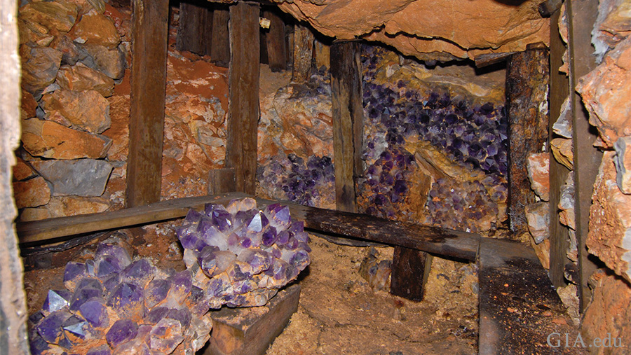 Large amethyst and ametrine crystals line the walls of Bolivia’s historic Anahí mine, showcasing the February birthstone. Large amethyst and ametrine crystals line the walls of Bolivia’s historic Anahí mine, showcasing the February birthstone.