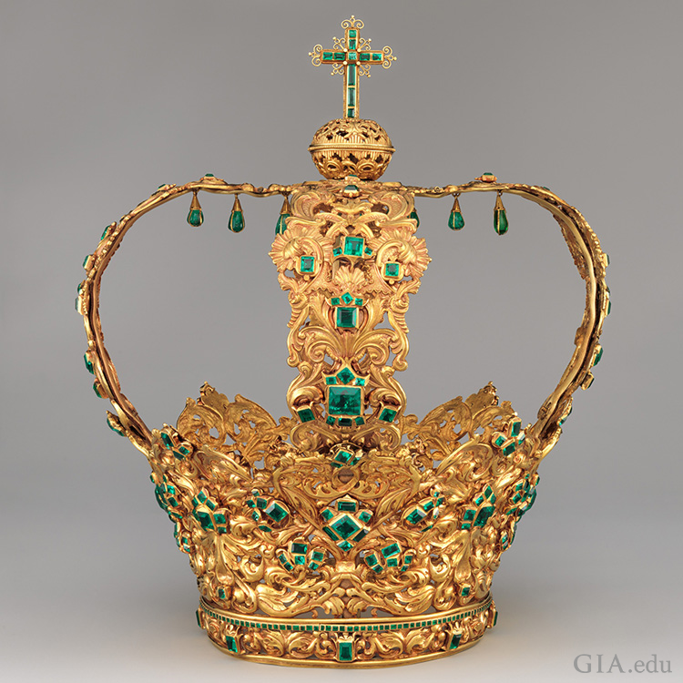 The Crown of the Andes boasts the May birthstone with a 24 carat emerald center stone and 442 additional emeralds set in the intricately crafted golden headpiece. The Crown of the Andes boasts the May birthstone with a 24 carat emerald center stone and 442 additional emeralds set in the intricately crafted golden headpiece.
